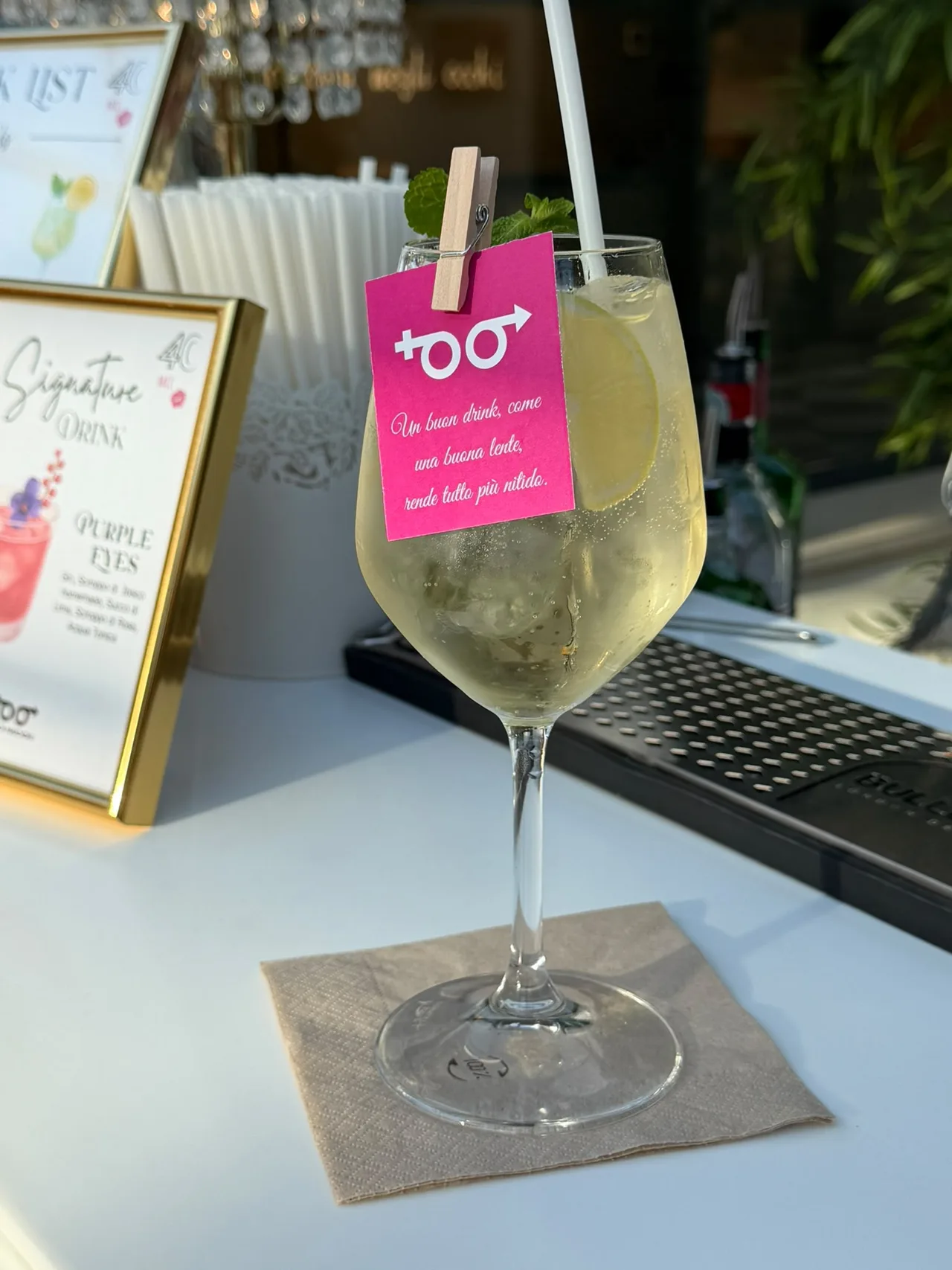 Cocktail with a tag carrying the company logo and a custom line