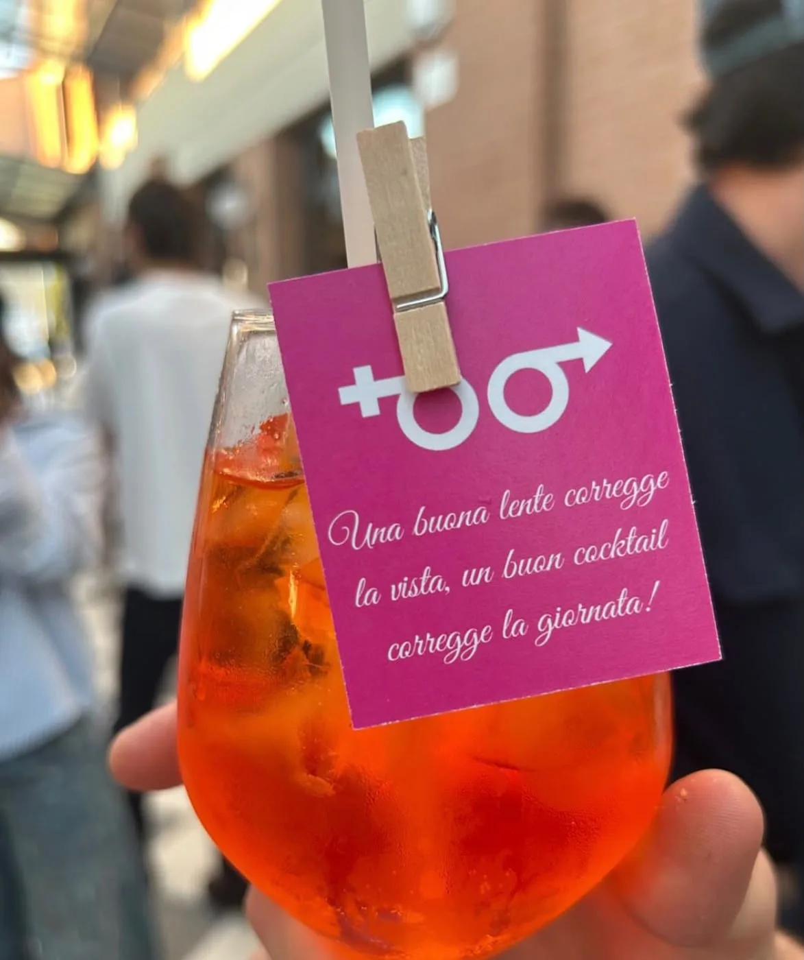 Spritz with a branded tag held by a wooden peg