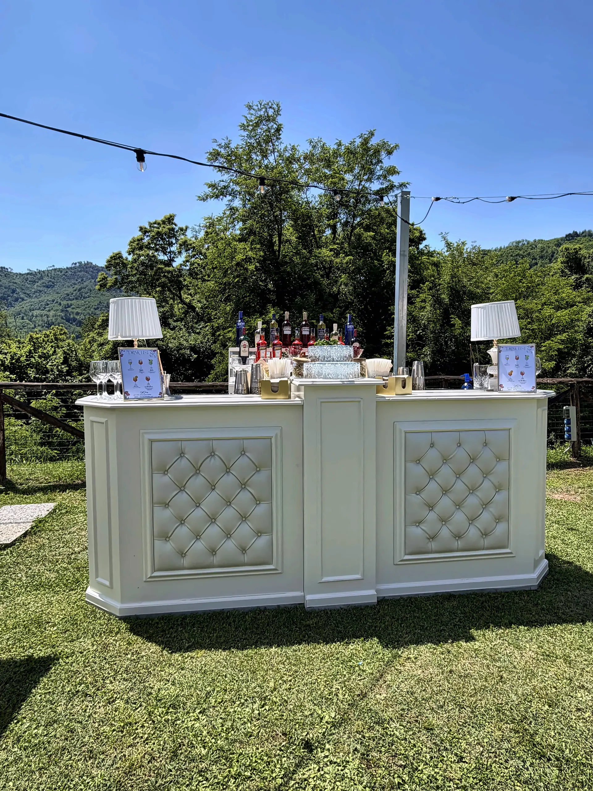 Padded white bar on the lawn at Borgo Giusto, near Lucca