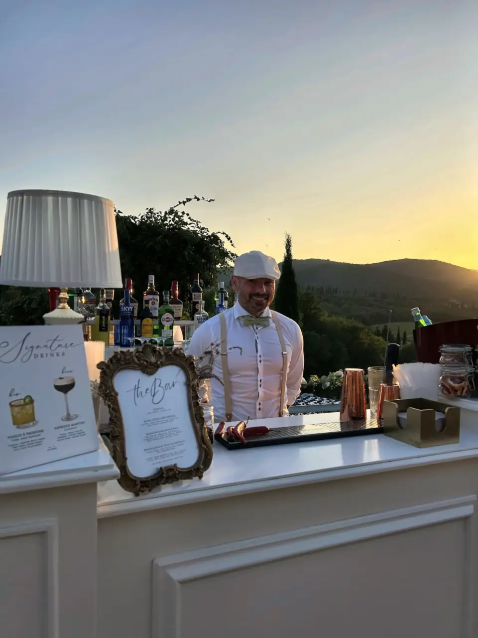 Bartender and drink list at sunset on the terrace