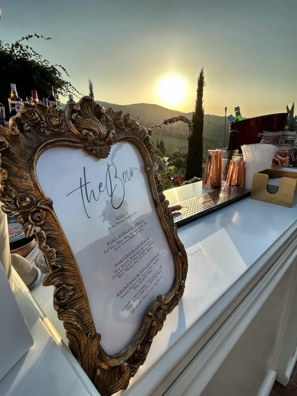 Bar sign in a baroque gold frame at sunset in Chianti