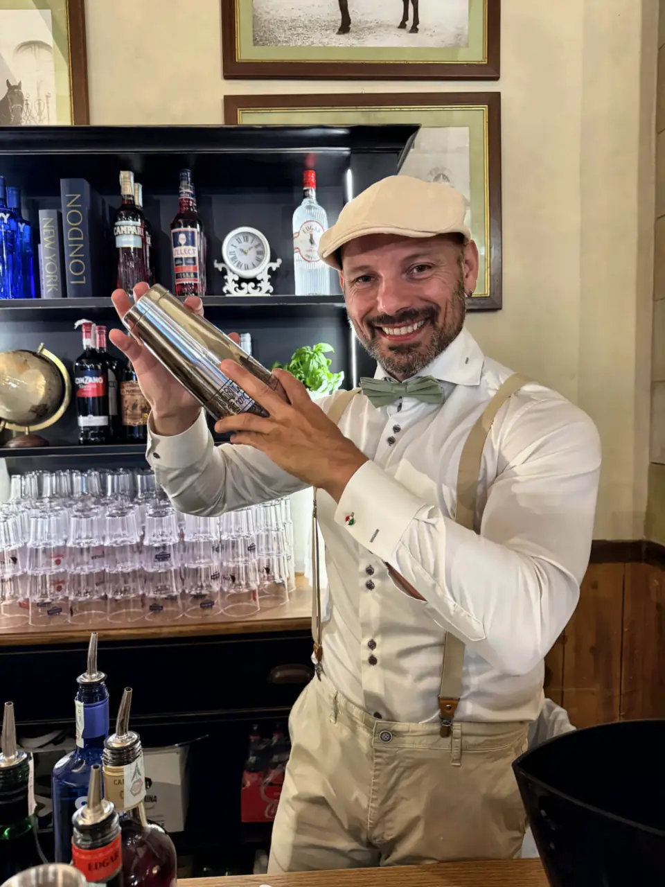 Bartender shaking a cocktail at the black bar