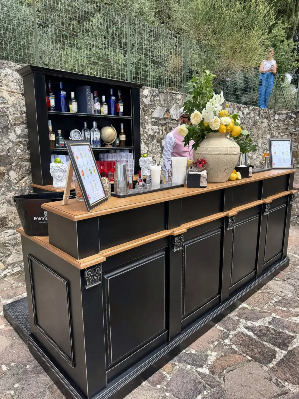 Black bar and stone wall at Villa Catignano