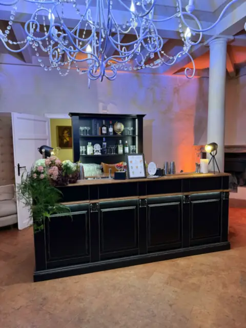 Black wooden wedding bar in the hall of Villa di Ulignano, Volterra