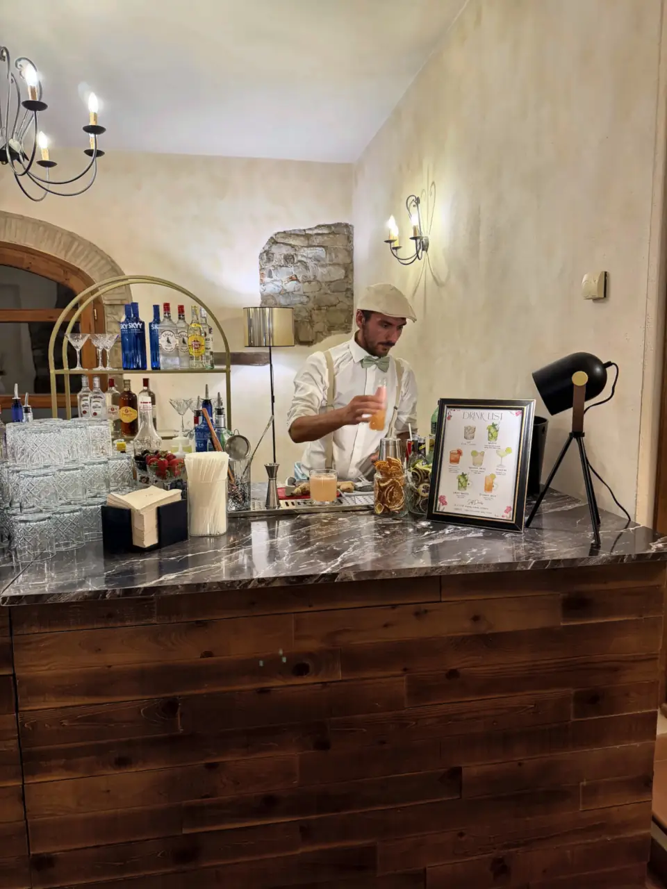 Bartender at the marble bar of Villa Il Granduca, Carmignano
