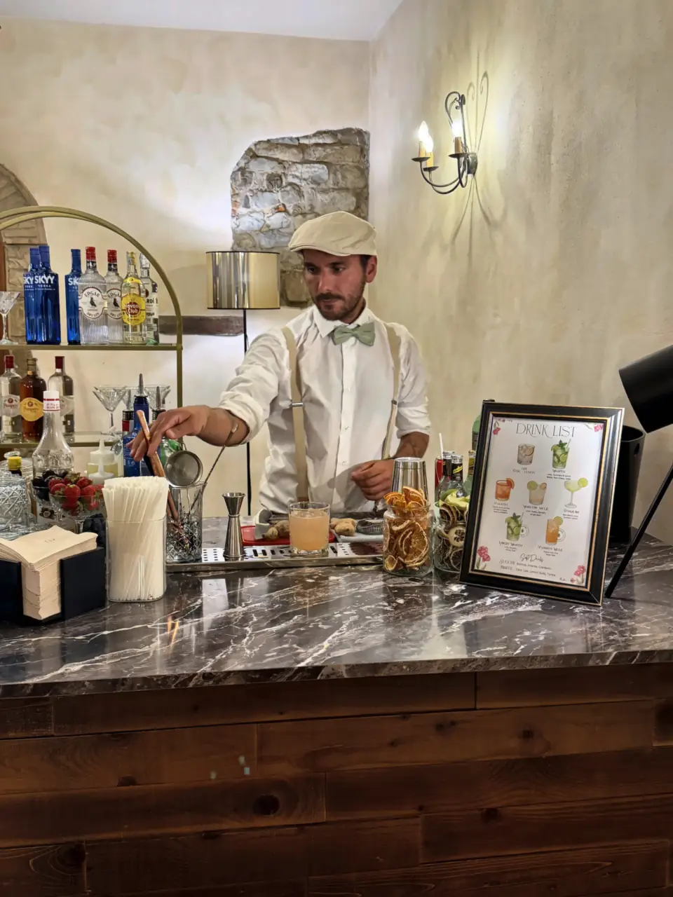 Making a cocktail at the bar of Villa Il Granduca