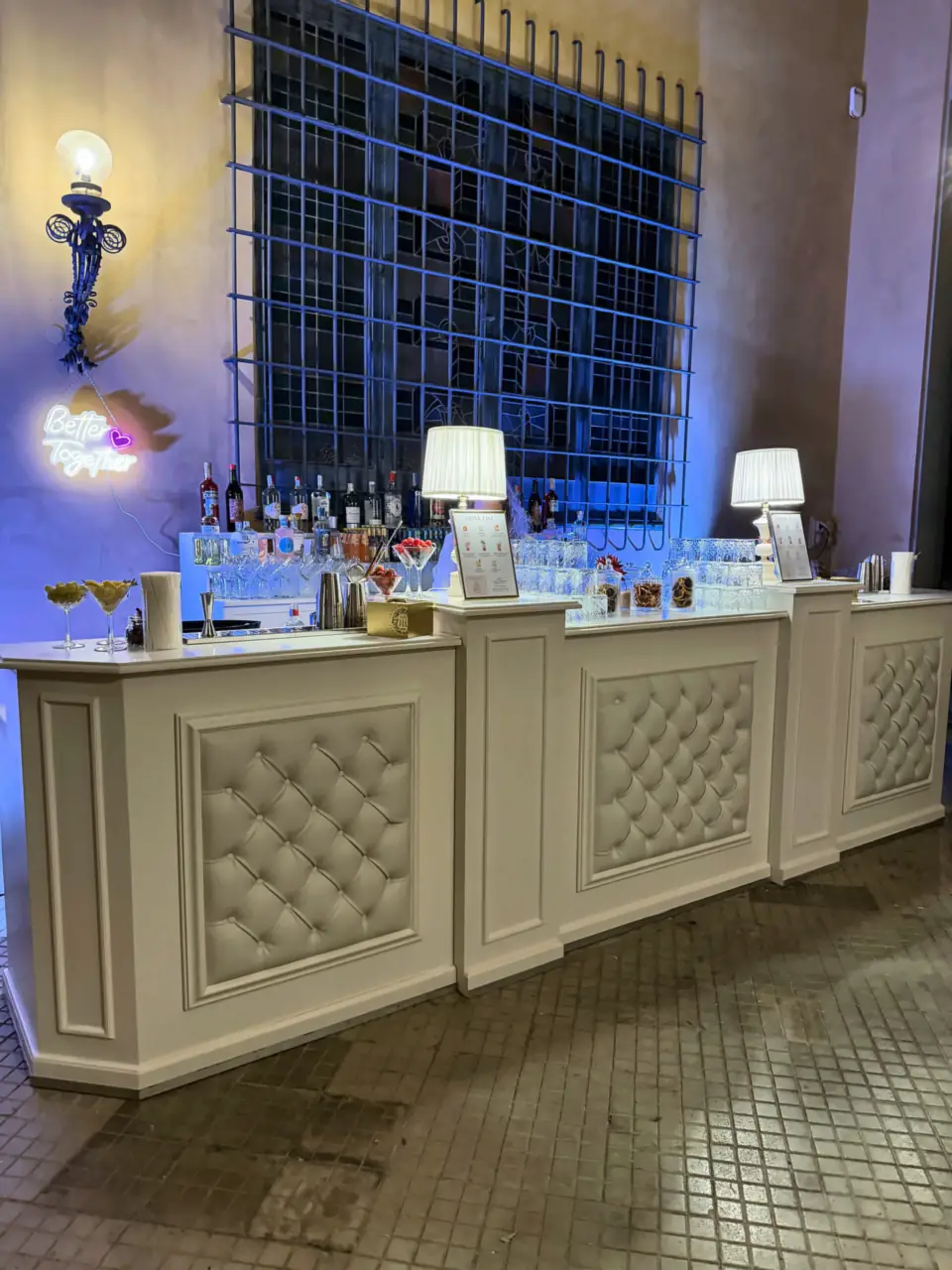 Three-module white padded bar with neon sign, villa in Montemurlo