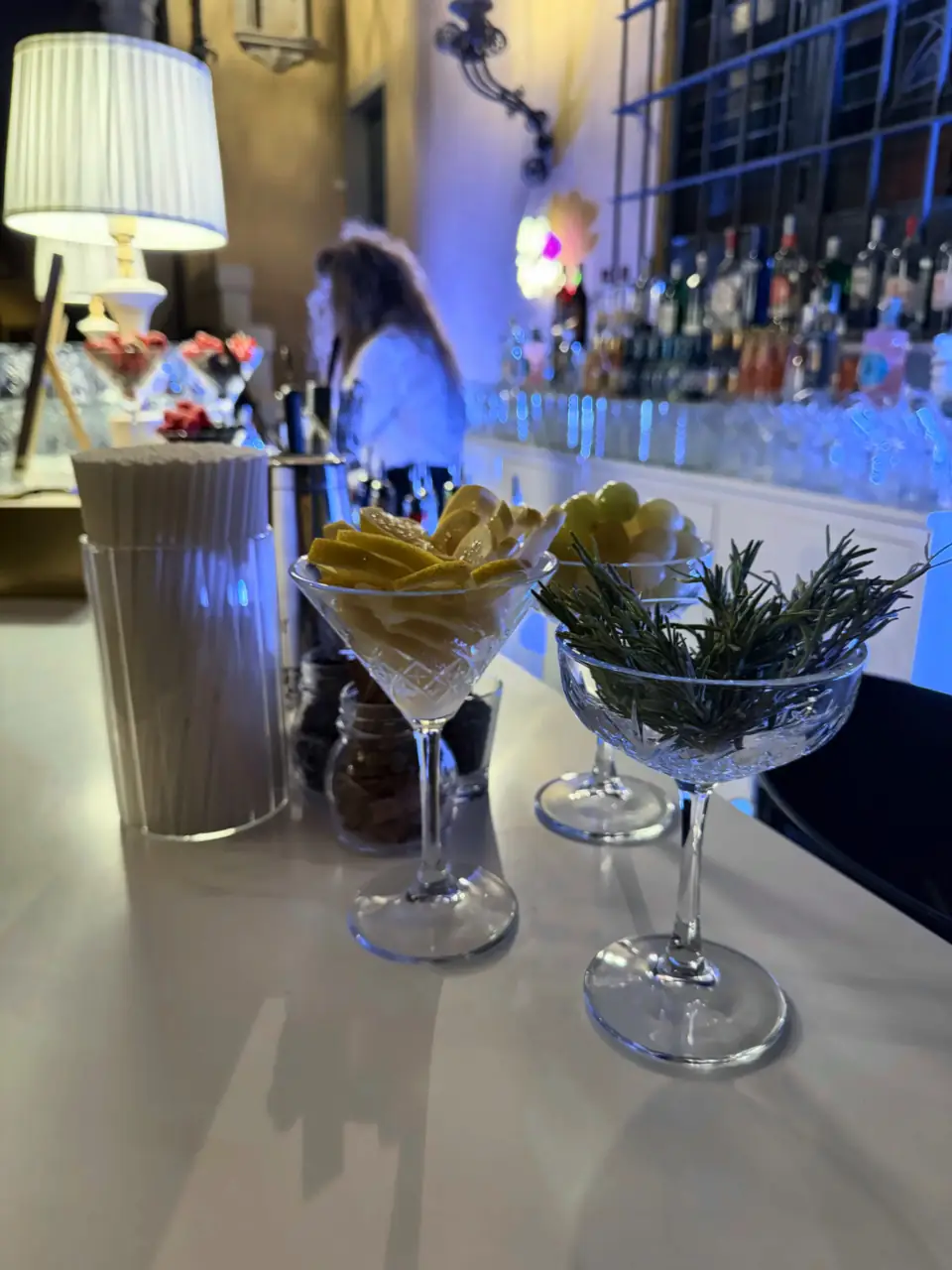Lemon and rosemary garnishes ready on the bar